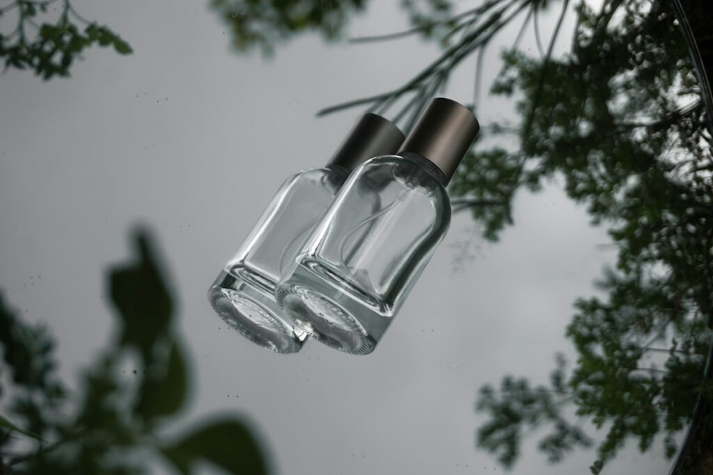 a glass bottle floating on top of a body of water